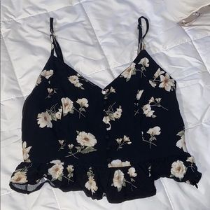 Cute top with white flowers on it